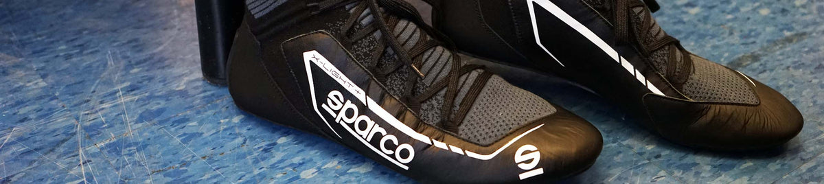 Sparco auto and kart racing gear with professional racing seats, harnesses, and motorsports accessories