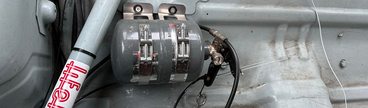 Lifeline fire suppression systems and racing harnesses installed in professional motorsports safety applications