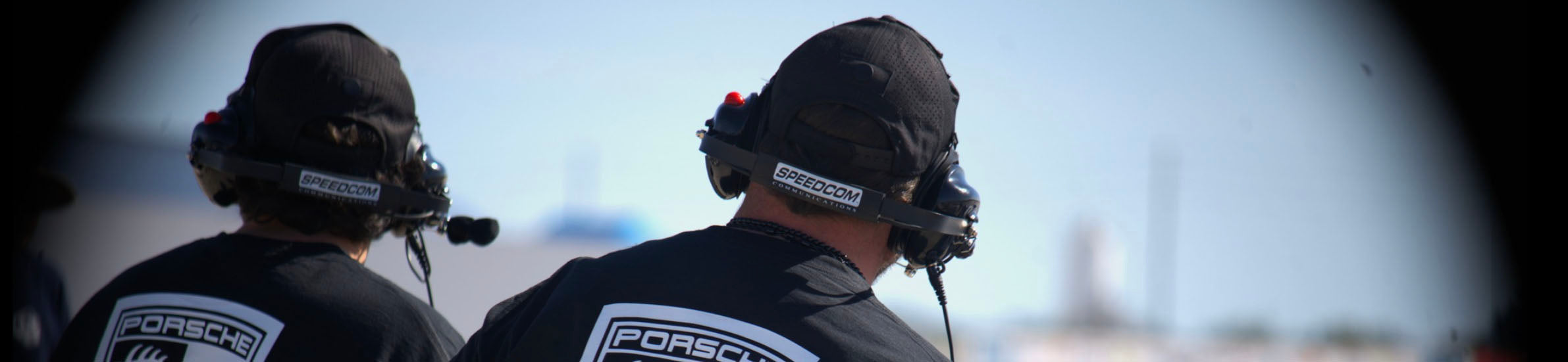 Speedcom racing communications gear with driver headsets and radio systems used in professional auto racing environments